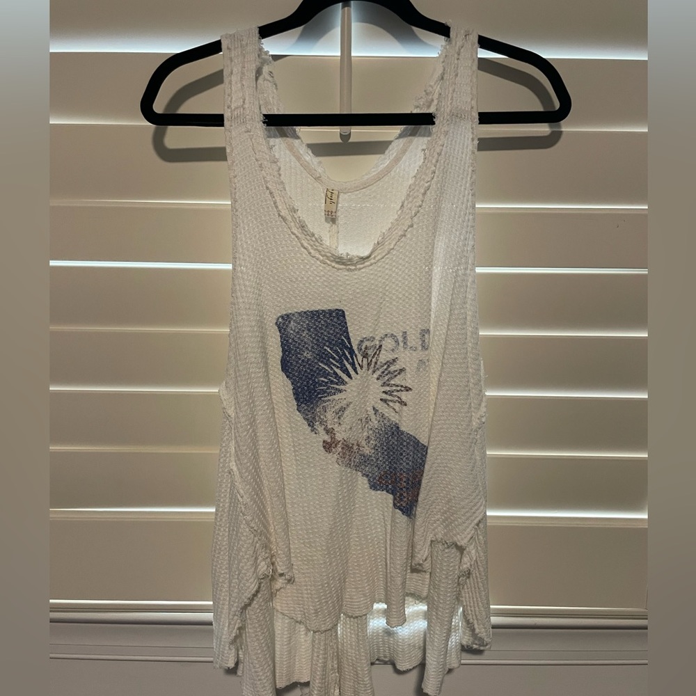 White loose free people tank top with big sleeve holes